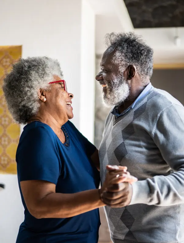 elderly couple dancing in living room for some reason